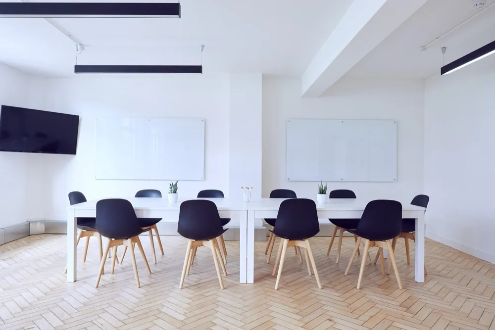 Modern living space with clean lines suited to office and commercial interiors by The Omega Group